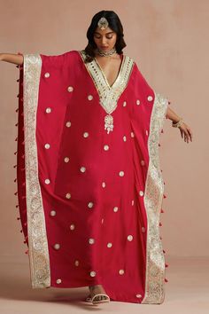 Crimson magenta kaftan with floral gota embroidery and tassel detailing. Paired with slip.
Components: 2
Pattern: Embroidered
Type Of Work: Floral
Neckline: V neck
Sleeve Type: Kaftan sleeves
Fabric: Kaftan: Pure Muslin, Slip: Shantoon
Color: Red
Other Details: 
Kaftan sleeves
Tassels detailing
Length:
Kaftan: 54 inches
Slip: 48 inches
Occasion: Puja - Aza Fashions Floor-length Kaftan For Navratri Ceremonies, Anarkali Kaftan For Traditional Ceremonies, Anarkali Gota Work Kaftan For Wedding, Bollywood Style Wedding Kaftan With Gota Work, Navratri Pallu Kaftan For Traditional Ceremonies, Festive V-neck Traditional Wear For Eid, Floor-length Pallu Kaftan For Traditional Ceremonies, Floor-length Kaftan With Pallu For Traditional Ceremonies, Anarkali Kaftan With Resham Embroidery For Traditional Ceremonies