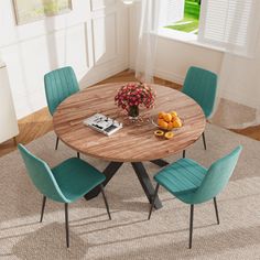 a round wooden table with blue chairs around it