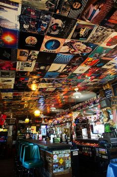 the ceiling is covered with posters and pictures