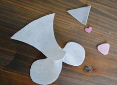 paper hearts are cut out and placed on the table