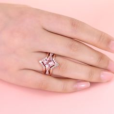 Celebrate your journey of love with this exquisite set, and let its timeless beauty be a reflection of your everlasting commitment. This exquisite ring showcases a mesmerizing princess-cut morganite as its centerpiece, capturing attention with its radiant beauty. The ring's design is a true masterpiece, with a twist motif adorning the ring shank, symbolizing the intertwining of two souls on their journey of love. The intricate details and delicate craftsmanship make this piece a true work of art, blending timeless charm with contemporary flair. Completing the set is two matching bands, perfectly complementing the engagement ring and enhancing its overall splendor. Together, they create a harmonious symphony of beauty and elegance, symbolizing the unity and everlasting bond between two hear Art Blending, Radiant Beauty, Journey Of Love, Divine Love, Sterling Silver Rings Set, Ring Shank, Silver Ring Set, Matching Band, Morganite