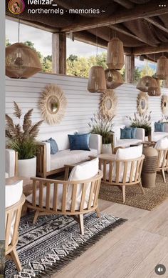 an outdoor seating area with chairs, tables and plants on the wall behind it is decorated with hanging lights