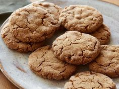 a white plate topped with cookies on top of a table