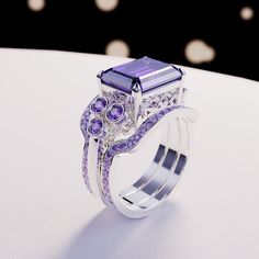 Introducing The Violet Love: This bold statement ring is perfect for any occassion. As a gift for her, a wedding ring or a gift for yourself - because you deserve it - it is guaranteed to impress. This ring is made as a 3-in-1 triple ring set. 2 perfectly fitting bands to complement the big bold center main ring. A bold and beautiful simulated amethyst sits like a crown in the center of a gemstone halo. The sides covered with beautiful simulated diamonds and purple enamel. Underneath you have pr Triple Ring, Blood Diamond, You Deserve It, Luxury Gift Box, Silver Pieces, Amethyst Gemstone, 3 In 1, Exquisite Design, Emerald Cut