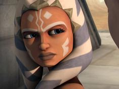 an animated character with blue eyes and brown hair wearing a white headdress in star wars the old republic