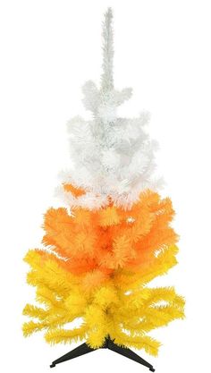 an orange, white and yellow christmas tree on a black stand