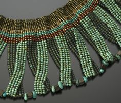 a necklace made with beads and stones