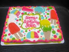 a birthday cake decorated with ice cream and popsicles