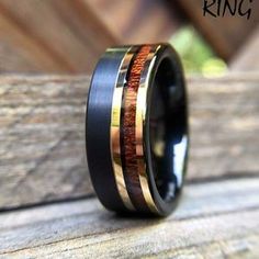 a wedding ring with wood and gold inlays