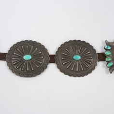 1930s Navajo Concho Belt with a Handmade Sterling Silver Ketoh-Style Buckle and Six Conchos featuring Hand Stamped and Repousse Designs and set with Natural American Turquoise. This concho belt features .75” wide brown leather that is original to the belt. Buckle Dimensions: 4.5” Width, 3.75” HeightConcho Dimensions: 4” Width, 3.5” HeightBelt Width: .75"Belt Length: 42” Maximum Length, Holes Punched from 29” - 42” Zuni Jewelry, Concho Belt, Navajo Jewelry, Belt Length, American Turquoise, Native Jewelry, Pendant Rings, Art Clothes, Handmade Sterling Silver