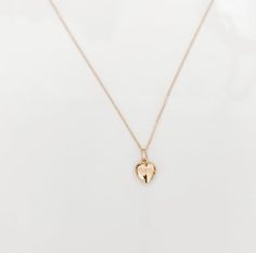 The perfect dainty gold chain with a cute little heart charm. The perfect stacking necklace! Please note the heart is tiny.Now available in solid 14K gold or high quality gold filled.NOTE: Gold-filled jewelry has a much higher amount of gold in it than gold-plated, making it more valuable (almost 100% more gold than gold-plated jewelry), more durable (won't chip or tarnish), safe for those with metal allergies and longer-lasting (10-30 years). Dainty Everyday Heart Charm Necklace, Everyday Tiny Charm Necklaces In 14k Gold Filled, Everyday Tiny Charm Necklace In 14k Gold Filled, Everyday 14k Gold Filled Heart Necklace With Delicate Chain, Delicate 14k Gold Filled Heart Charm Necklace, Everyday Yellow Gold Heart Cut Charm Necklace, Everyday 14k Yellow Gold Filled Heart Necklace, Everyday 14k Gold Filled Heart Charm Necklace, Yellow Gold Heart Charm Necklace In 14k Gold Filled