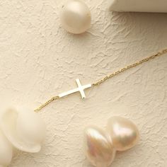 This beautiful, dainty cross bracelet is the perfect gift for a special women or young girl celebrating her first communion. Crafted from brilliant gold, this piece of cross jewelry will remind her of her each time she wears it. Can you imagine her joy when she opens the gift? Please note that we also offer matching Cross Pendant Necklace in our shop! Elegant Crucifix Cross Necklace For Baptism, Elegant Bracelet Jewelry For Baptism, Dainty Yellow Gold Rosary Bracelet As Gift, Elegant Cross Pendant Bracelet As A Gift, Elegant Bracelet For First Communion, Elegant Cross Jewelry For First Communion, Elegant Cross Rosary Bracelet As Gift, Dainty 14k Gold Jewelry For Baptism, Elegant Gold Jewelry For Confirmation