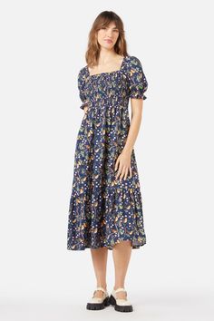 Featuring darling Robin birds & romantic cherry blossom florals, this short sleeve midi dress has a comfy shirred bodice & ruffle hem detail- shirred bodice - sweet puff sleeve with elastic shirring at cuff- length finishes at the ankle- handy side seam pockets- ruffle at hem- made from a linen viscose blend- available in navy Product Code: PGFY022 Summer A-line Puff Sleeve Dress With Smocked Bodice, Summer A-line Midi Dress With Smocked Bodice, Spring Midi-length Smocked Dress With Elastic Sleeves, Spring Midi-length Puff Sleeve Smocked Dress, Bohemian V-neck Midi Dress With Smocked Bodice, Robin Bird, Midi Short Sleeve Dress, Dress 16, Ruffle Hem