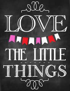 a chalkboard sign that says love the little things with bunting and pennants