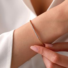 Add a touch of sophistication to your style with the Mon Cheri Diamond Bracelet. Crafted in 18K Gold, this bracelet features shimmering diamonds weighing 0.29 carats. The design is simple yet elegant, perfect for dressing up an outfit or adding a touch of glam to your everyday look. Everyday Luxury Flexible Diamond Bracelet, Elegant Diamond Bracelet With Pave Setting, Elegant Diamond Bracelet With Pave Setting As Gift, Elegant Diamond Bangle Bracelet With Pave Setting, Luxury Everyday Gold Cubic Zirconia Bracelet, Luxury Everyday Gold Bracelet With Cubic Zirconia, Elegant Bracelets With Pave Setting As Gift, Elegant Bracelets With Pave Setting For Gift, Timeless Pave Setting Bracelet Gift