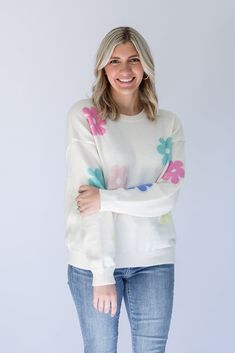 Are you ready to brighten everyone's day with our Flower Power Daisy Print Sweater!? This white knit sweater has the most adorable pastel daisy print that is perfect to help you transition from Winter to Spring. This sweater is perfectly light weight and detailed with a ribbed contrast hem around the round neckline and arm cuffs. Pair it with jeans on a chilly day, or with shorts for the perfect Spring look! - White knit sweater with pastel daisy print - Light weight knit sweater - Ribbed contra Cute Crew Neck Sweater For Spring, White Spring Sweater With Ribbed Cuffs, White Ribbed Cuffs Sweater For Spring, White Sweater With Ribbed Cuffs For Spring, White Floral Print Sweater For Spring, Trendy Floral Print Sweater For Spring, Trendy Floral Print Crew Neck Sweater, White Soft Knit Sweater For Spring, Trendy Spring Crew Neck Sweater