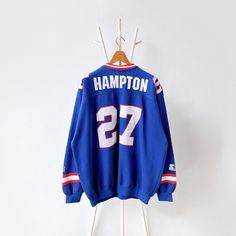 90s New York Giants X Rodney Hampton player NFL sweatshirt/ XL * PLEASE READ BEFORE PURCHASE * PLEASE consider the PHOTOS before making the decision * The images may DIFFER in appearance from the actual product because we took pictures under daylight.  * PLEASE send your PHONE NUMBER after your purchase for the shipping company to contact you X No returns X No refund Condition : 8/10 More details : hole (front)/ mottleds (front/ sleeve)/ look at the pictures  Brand : starter Size : XL Pit to pit Nfl Sweatshirt, 90s New York, Shipping Company, New York Giants, The Hamptons, Phone Number, Sweat Shirt, Favorite Outfit, Nfl