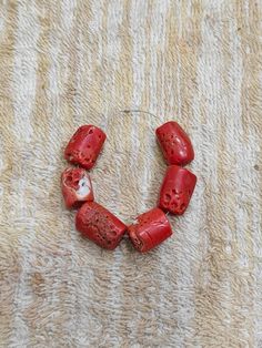 Unleash your creativity with these beautiful Italian red coral beads! Perfect for making surfer and choker necklaces, these 6 polished beads are 11x12mm and 12x16mm in size. Add a vintage touch to your jewelry collection with these natural gemstones from Italy. #ItalianRedCoral #SurferNecklace #ChokerNecklace #JewelryMaking #VintageGems 😍📿 Red Coral Polished Beads For Jewelry Making, Red Coral Beads For Jewelry Making, Large Red Coral Beads For Jewelry Making, Red Coral Spacer Beads, Round Shape, Red Coral Spacer Beads, Handmade Red Coral Beads For Jewelry Making, Handmade Red Coral Round Beads, Red Coral Round Spacer Beads, Handmade Red Coral Beads