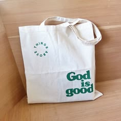 "God is Good Tote Bag | Bible Tote | Christian Tote Bag | Christian gift | Bible Verse Christian Canvas Tote Bag | Christian Bible Bag Hi, Welcome to Things Above! We sell Christian based apparels and tote bags that are comfortable, soft and in high quality. If you have any questions at all feel free to message us! We look forward to make you and your loved ones happy and satisfied. * If you would like to have a customized design or color, send us a message! Our designer will be happy to help you. ⟡ Product Description ⟡ *  6.0 oz 100% cotton canvas *  Folds flat *  Size: 14 1/2\" x 15 1/2\" ⟡ Care Instructions ⟡ * Wash item inside out in cold water * Do not bleach * DO NOT TUMBLE DRY!! * Do not dry cleaning * Do not iron directly on the design ⟡ Production and Shipping ⟡ *  Processing is Eco-friendly Green Bag With Letter Print, Eco-friendly Green Bags With Letter Print, Green Bag With Letter Print For Gift, Green Letter Print Bags As Gifts, Christian Tote Bags Paint, Bible Bags Totes Diy, Christian Tote Bag Design, Christian Totes, Christian Bags