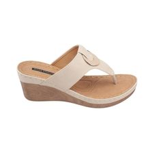 Get versatile appeal with GC Shoes' Genelle wedge sandal. Its leather top and faux wooden bottom create a modern look that adds a pop of fun to any outfit. Plus, the footbed has extra cushioning for all-day comfort. Never having to sacrifice style for comfort. Perfect for staying stylish and comfortable on the go. Comfortable Wedge Sandals With Textured Footbed, Comfortable Leather Toe Post Wedge Sandals, Modern Beige Wedge Sandals With Round Toe, Modern Beige Wedge Heel Sandals, Modern Beige Wedge Sandals For Beach, Beige Synthetic Wedge Sandals With Arch Support, Beige Wedge Sandals With Arch Support And Round Toe, Modern Wedge Heel Sandals With Textured Footbed, Wedge Sandals With Toe Post And Arch Support