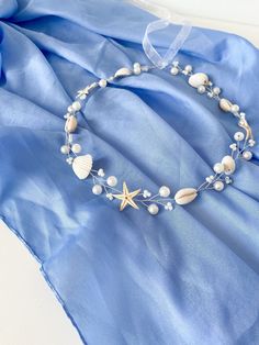 Ocean Dreams Wedding Hair Accessories. Capture the essence of the ocean with this stunning set of white seashell pearls and starfish wedding hair accessories. The delicate vine and hair pins are adorned with shimmering pearls, natural seashells, and charming starfish, creating a truly enchanting look. Perfect for beach weddings, mermaid-inspired themes, or any occasion where you want to add a touch of coastal elegance. Embrace the beauty of the ocean and create a truly unforgettable look with th Beach Wedding Hair Accessories, Beach Wedding Accessories, Starfish Wedding, Ocean Wedding, Hair Wreaths, Beach Wedding Hair, Mermaid Inspired, Bridal Hair Vine, Beach Theme Wedding