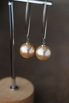 Lovely earrings with delicate cream beige colore pearl coated acrylic 14 mm beads, small stainless steel beads-connectors and stainless steel V shape long earring hooks. Perfect earrings for everyday wear! *The total lenght of earrings is about 58 mm including earring hooks. Other earrings of my shop you can see here: https://www.etsy.com/shop/NaTavelli?section_id=13757927  Thanks for visit. Elegant Beige Nickel-free Earrings, Earring Long, Long Earring, Beads Earrings, Pearl Cream, Earrings Elegant, Long Dangle Earrings, Earrings Minimalist, Cream Beige