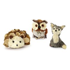 three small figurines of different animals on a white background, one has an owl and the other is a hedgehog