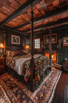 a bed sitting inside of a bedroom on top of a wooden floor next to a fire place