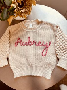 Custom, made to order toddler/baby chunky oversized sweaters!  I custom embroider your babies name in whatever font you like, great for birthdays, holidays, photo shoots, you name it ! These can get pretty custom, I provide sample colors but if you want something more custom, I can do it :) just message me on here!  Please provide the custom name you want with proper capitalization,   the color sweater, and name color you want with the order in the box below :) Thank you. Knit Name Sweater, Name Sweater Baby, Baby Sweater Knit, Name Sweater, Chunky Oversized Sweater, Custom Sweaters, Knit Baby Sweaters, Toddler Sweater, Name Embroidery