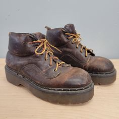 Dr Martens Brand Brown Boots 8315 7 Size tagged mens 7 Condition as is, cracking and wear Lace closure 12.25" insoles  11.5" sole 4.5" ball 1.75" heel 5.5" total height calf is 3.5"x4" 5"  bridge width Grunge Martin Boots With Chunky Platform And Round Toe, Vintage Brown Martin Boots For Outdoor, Vintage Brown Rugged Moto Boots With Round Toe, Rugged Round Toe Boots For Streetwear, Vintage Lace-up Boots With Leather Footbed, Grunge Martin Boots With Chunky Platform, Grunge Leather Platform Boots, Casual Chunky Boots For Streetwear, Grunge Lace-up Platform Boots