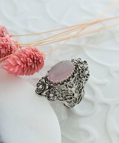 Rose Quartz Silver Oval Floral Statement Ring, 925 Sterling Artisan Made Handcrafted Flower Filigree Cocktail Ring Handmade Women Jewelry Pink stone ring, floral ring, flower basket ring, vintage ring, anniversary gift, birthday gift Material: 925 Sterling Silver (NICKEL FREE) Gemstone: Rose Quartz 10x14 mm. FREE, FAST AND TRACKABLE SHIPPING FOR ALL EU COUNTRIES AND USA. COMES WİTH VELVET POUCH AND LUXURY GİFT BOX. Show off this gorgeous ring at any occasion. This eye catching elongated oval sta Bohemian Pink Wedding Rings, Oval Flower Ring For Wedding, Silver Filigree Ring With Stone Setting For Wedding, Silver Oval Flower Ring Hallmarked, Silver Oval Hallmarked Flower Ring, Hallmarked Silver Oval Flower Ring, Silver Oval Flower Ring For Wedding, Sterling Silver Hallmarked Flower Ring With Oval Shape, Bohemian Oval Rings With Intricate Design