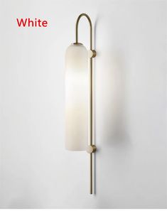 a wall light with a white glass shade