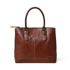 Introducing the City Chic Brown Leather Shoulder Tote—a versatile office bag designed for elegance and practicality. With a central compartment, inside pocket, and sturdy handles adorned with stylish buckles, it seamlessly blends class with functionality. Crafted from naturally tanned buffalo leather, this bag effortlessly transitions from office sophistication to casual chic. Perfect for brunch or quick outings with friends, it complements your style while prioritizing environmental responsibil Brown Bags With Leather Handles For Workwear, Classic Cognac Shoulder Bag With Double Handle, Classic Brown Briefcase For Everyday Use, Leather Satchel For Work, Classic Brown Everyday Briefcase, Brown Top Handle Briefcase For Daily Use, Timeless Brown Satchel With Double Handles, Everyday Cognac Satchel With Double Handle, Classic Tote Briefcase For Daily Use