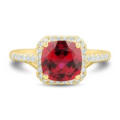 a ring with a large red stone surrounded by white and yellow diamond accents on the band