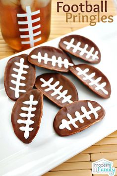 chocolate football cookies on a white plate with a drink in the background and text overlay that says football pringles