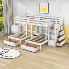 a white bunk bed sitting on top of a wooden floor