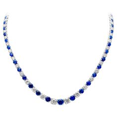 Luxurious and elegantly made riviere tennis necklace showcasing brilliant round blue sapphires and diamonds that elegantly alternate with each other and get larger to the center of the necklace. Set in a classic four prong basket setting. Blue sapphires weigh 17.66 carats total and Diamonds weigh 13.15 carats total, G-H color and SI1-SI2 in clarity. Finely made in 18k white gold, 17 inches, adjustable upon request. Roman Malakov is a custom house, specializing in creating anything you can imagine. If you would like to receive a special quote on a custom piece please message or call us. Riviera Necklace, Basket Setting, Round Sapphire, Custom House, Special Quotes, Tennis Necklace, Sapphire Diamond, Link Necklace, White Diamonds