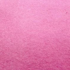 a close up view of a pink carpet with very soft, fuzzy textured material