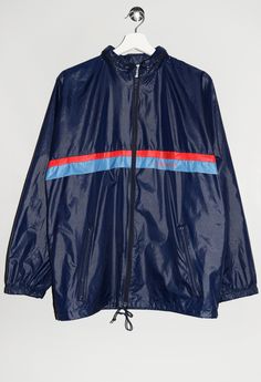 "Vintage late 90's Adidas windbreaker in navy blue with roll up hood and shoulder strap. - Size tag: Please always check measurements before buying. Tag reads DE176 cm, US 18- women's XL - Measurements (laying flat): Pit to Pit: 22\" Length: 28\" Pit to Cuff: 20\" -Wear: /Please see images for details/ Good vintage condition. The collar drawstring is missing, and a small glue stain on the right pocket as shown on the pictures. - Fabric: 100% Nylon *All of our items are preloved pieces so some signs of natural wear and age are to be expected. Please look through the photos carefully to check if the condition is to your satisfaction. *All efforts are made to show any defects however small imperfections may be missed. *We try to describe the sizes as accurately as possible, but please keep in Blue Track Jacket With Double-lined Hood For Streetwear, Urban Navy Windbreaker For Streetwear, Sporty Navy Windbreaker With Double-lined Hood, 90s Blue Windbreaker For Streetwear, Navy Casual Nylon Track Jacket, 90s Blue Windbreaker For Fall, Navy Track Jacket For Spring Streetwear, Navy Nylon Track Jacket For Streetwear, Navy Vintage Windbreaker For Streetwear