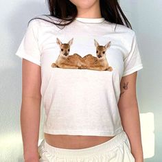 Fawn Deer Graphic 90s Baby Tee, Aesthetic Tee, Women's Fitted Tee, Unisex Shirt, Trendy Top, Y2K 90s Baby Tee, Gift For Her, Gift For Friend DETAILS - 100% cotton (fiber content may vary for different colors) - tear-away label  SIZING Sizes vary by shirt style. Please check the size chart before making your purchase. PLEASE NOTE: Our Baby tee is sized for a youth, reminiscent of the '90s-era shrunken-down T-shirt. This style, popularized by the skater/raver culture of the time, is not to be conf