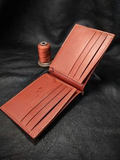 "Dear Visitor; As you see in these pictures ;You will see two types of money clip wallets. One is a single color model and the other is a double color model. You can specify the leather color combinations you want to use in your message. I can type few characters (2-3) like your initials. It is suitable for formal and casual occasions.                                                          My wallets are  made from vegetable tanned leather which is produced by https://www.sepici.com.tr/ I don't work with faux leather at all. My wallets don't have any foul or sharp smell because I reject to use any aggressive chemicals / glues which is not safe for me in the first place. My method is old style. All items and all parts are %100 handmade (cutting, painting, stitching and burnishing). No ele Classic Bifold Coin Purse For Daily Use, Classic Handmade Wallet For Everyday Use, Artisan Brown Wallets With Interior Card Slots, Artisan Brown Wallet With Interior Card Slots, Classic Handmade Card Holder For Daily Use, Brown Bifold Card Holder With Coin Pocket, Vintage Bifold Wallet With Rfid Blocking, Cognac Wallet With Interior Card Slots For Gift, Cognac Wallet With Interior Card Slots As Gift