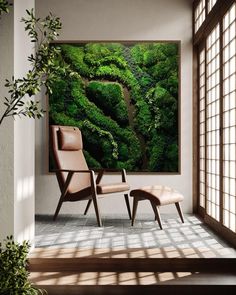 an empty room with a painting on the wall and two chairs in front of it