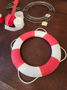 the life preserver is made out of construction paper and other crafting supplies are on the table