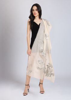 This striking ivory scarf is woven from a very fine cashmere and adorned with contrasting grey and silver flower appliques in lurex. With wispy eyelash fringes, this is perfect glam accessory over a LBD whilst keeping you comfortably warm. Elegant Cream Scarves For Festive Season, Elegant Cream Shawl Dupatta, Elegant Cream Shawl For Festive Season, Elegant Cream Shawl For Festive Occasions, Elegant White Pashmina Shawl For Festive Occasions, Elegant White Pashmina Dupatta, Elegant Beige Scarves For Festive Season, Elegant Beige Festive Scarves, Elegant Embroidered Cream Scarves