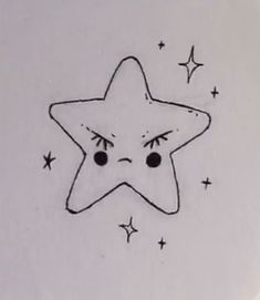 a drawing of a star with eyes drawn on it