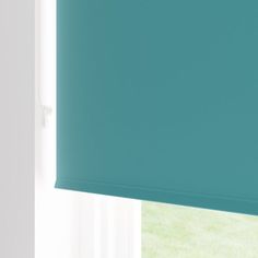 a blue roller shade hanging on the side of a window