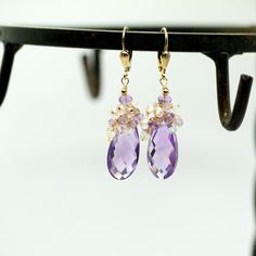 "Pink Amethyst, Rose Quartz and Ethiopian Opal Gemstone Earrings in Gold Filled. Stunning large Pink Amethyst briolettes, wrapped with high quality 14k gold filled wire, suspended from a cluster of shimmering Opal, Pink Amethyst and Rose Quartz beads. These are the best quality Pink Amethyst gems I have seen, transparent with a warm and uniform color - really unique and one of a kind! Light, dangly, shimmering feminine, chic statement earrings, perfect for special occasion, wedding, holidays or Amethyst Earrings With Gemstone Accents For Wedding, Amethyst Gemstone Earrings For Wedding, Elegant Lavender Earrings With Gemstone Accents, Amethyst Gemstone Wedding Earrings, Wedding Amethyst Earrings With Gemstone Accents, Wedding Earrings With Amethyst And Gemstone Accents, Briolette Earrings With Gemstone Accents For Wedding, Briolette Gemstone Earrings For Wedding, Purple Briolette Earrings For Wedding