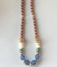 the necklace is made with beads and wood