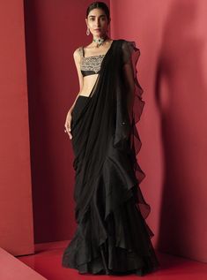 This set features a black embroidered chanderi blouse paired with a draped chiffon and organza saree. Color: Black Fabric: Chanderi; Chiffon; Organza Care: Dry Clean Only Black Sari, Latest Saree Trends, Ridhi Mehra, Ruffle Saree, Drape Saree, Saree Designs Party Wear, Satin Saree, Black Saree, Saree Trends