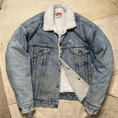 International Shipping Available! This is a killer Vintage 1980s Levis Sherpa Lined Denim Jacket! This is in worn in distressed vintage condition as pictured. This is around a mens size Large and labeled as such. Please refer to all pictures and measurements before buying since all sales are final. All measurements taken while laying flat. 25.5 inches from armpit to armpit. 26 inches from lower collar seam in back of neck to bottom of jacket. 23 inch shoulders. 22.5 inch sleeves. Since all sales Rugged Distressed Winter Outerwear, Faded Distressed Denim Jacket For Winter, Winter Faded Distressed Denim Jacket, Retro Faded Outerwear For Streetwear, Vintage Denim Outerwear For Winter, Vintage Winter Denim Outerwear, Vintage Denim Jacket Medium Wash For Winter, Vintage Winter Denim Jacket In Medium Wash, Faded Retro Denim Jacket For Winter